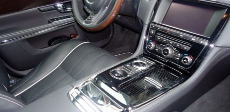 Jaguar center console and quilted leather after an interior detail