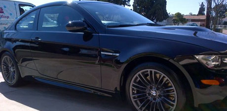 Black BMW M3 with a mirror-gloss finish