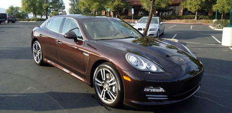 Dark red Porsche Panamera with a deep glossy finish