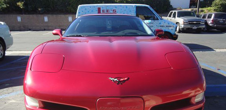 Red Corvette with a mirror-gloss hood after detailing
